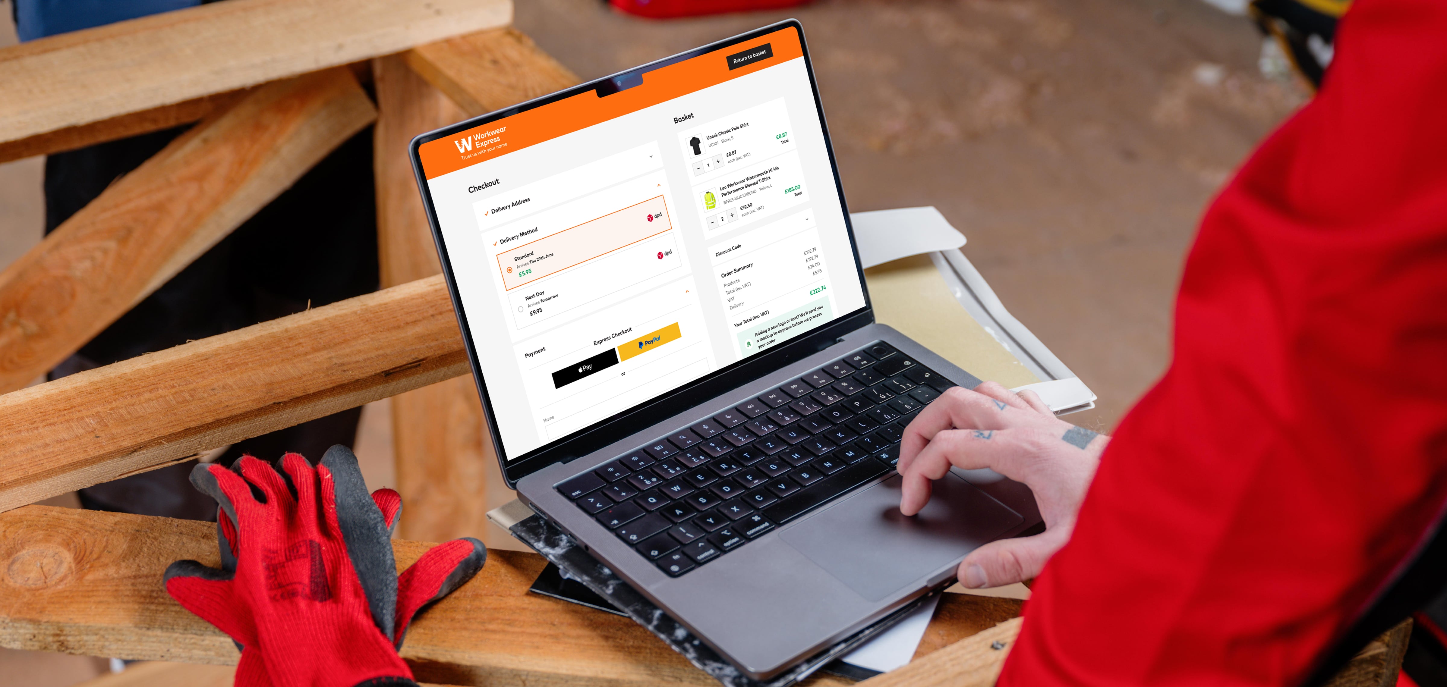 Workwear Express ecommerce design work shown on a laptop on a workshop bench